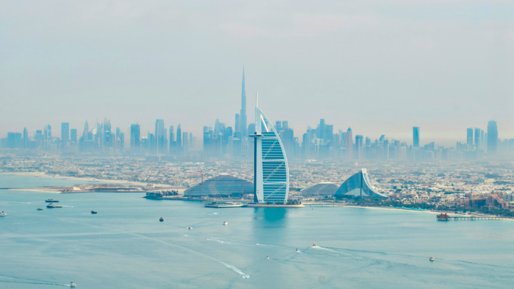Dubai skyline with construction cranes reflecting off-plan property growth
